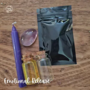 Emotional Release Spell Kit with purple candle, amethyst, herbs and scroll for letting go and emotional healing rituals.